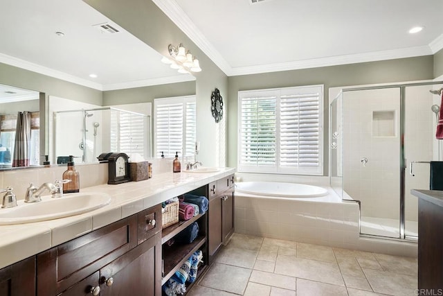 bathroom with plus walk in shower, vanity, crown molding, and tile patterned flooring