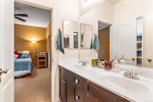 bathroom featuring ceiling fan and vanity