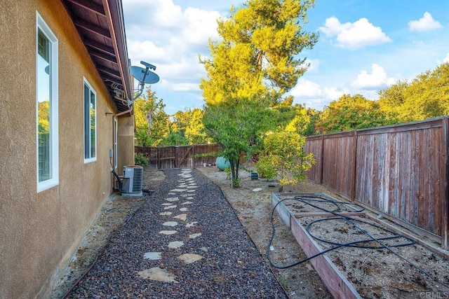 view of yard with central AC unit