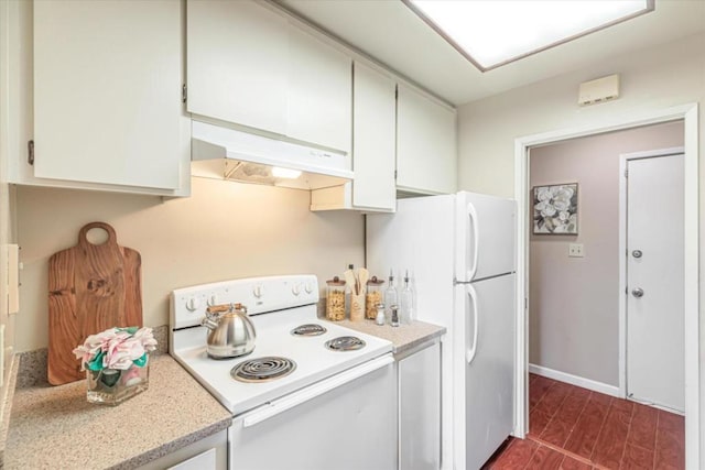 kitchen featuring white cabinetry and white appliances