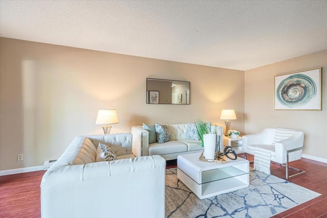 living room featuring a textured ceiling, baseboard heating, and hardwood / wood-style floors