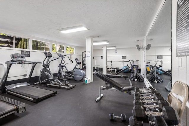 workout area featuring a textured ceiling