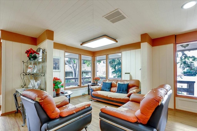 living room with light hardwood / wood-style flooring