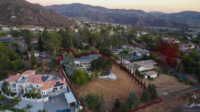 aerial view at dusk with a mountain view