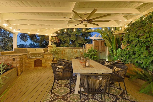 deck with ceiling fan, a grill, area for grilling, and a pergola