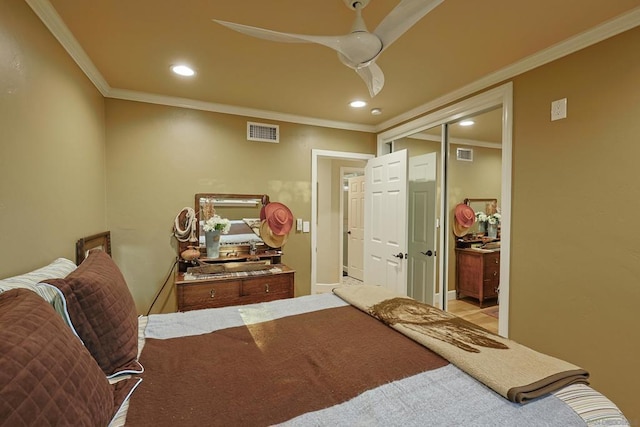 bedroom featuring ceiling fan, a closet, and crown molding