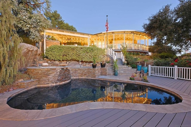 view of pool with a wooden deck