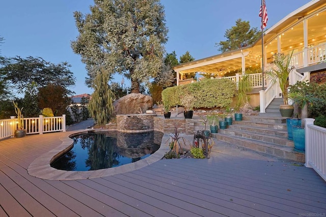 view of swimming pool featuring a wooden deck