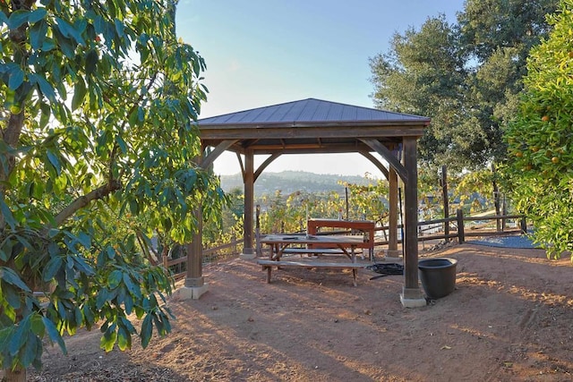 view of community with a mountain view and a gazebo