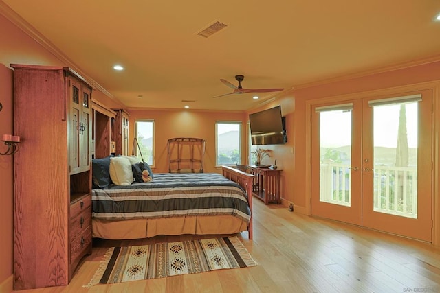 bedroom featuring french doors, access to outside, ceiling fan, light hardwood / wood-style flooring, and crown molding