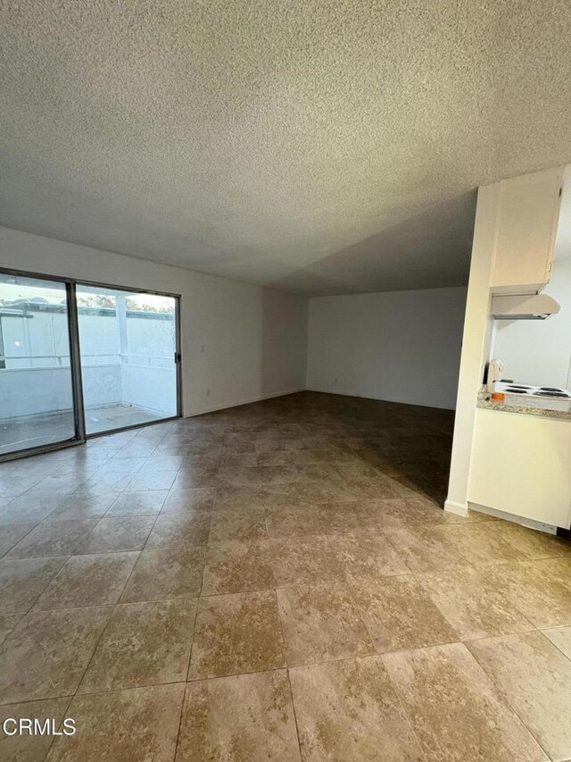 spare room featuring a textured ceiling