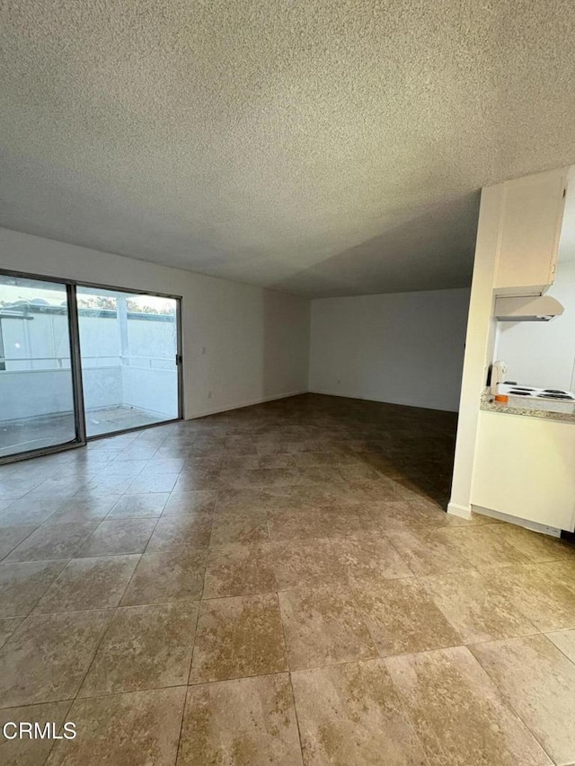 empty room with a textured ceiling