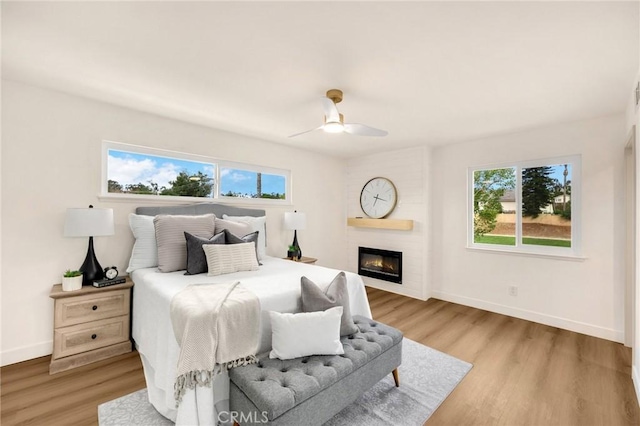 bedroom featuring ceiling fan and light hardwood / wood-style floors