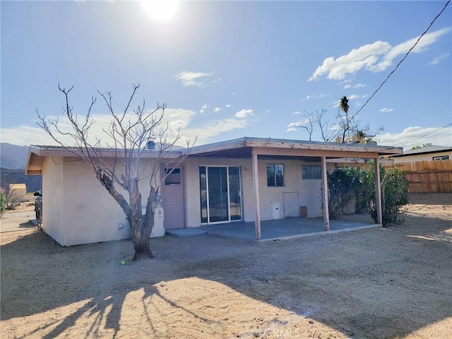 back of property featuring a patio area