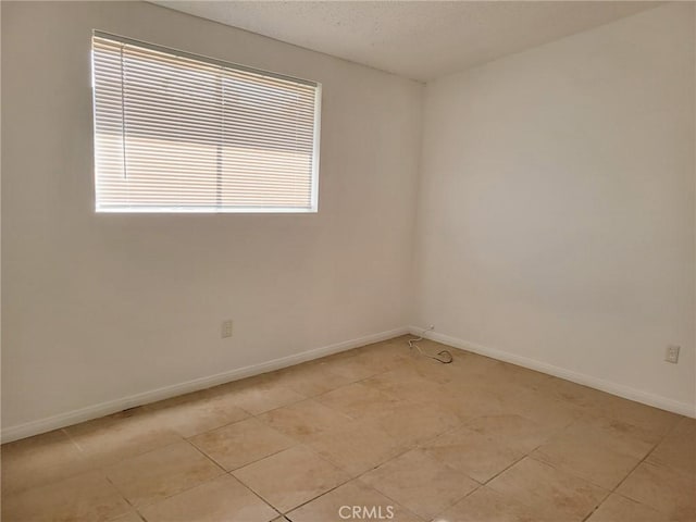 empty room featuring light tile patterned floors