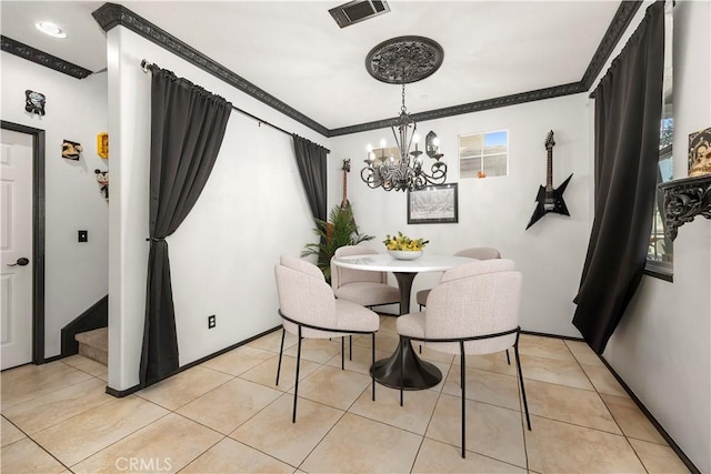 dining area with light tile patterned floors, ornamental molding, and a chandelier