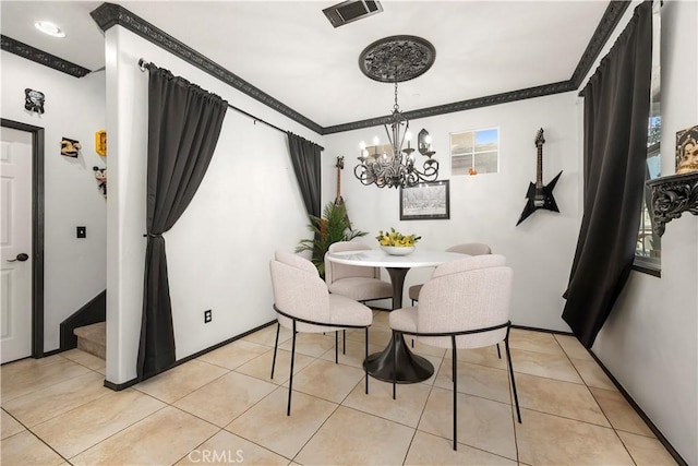 dining area featuring an inviting chandelier, light tile patterned flooring, visible vents, and ornamental molding