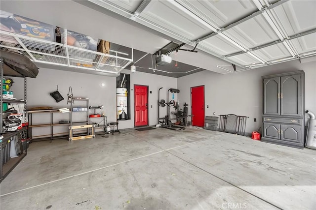 garage with secured water heater and a garage door opener