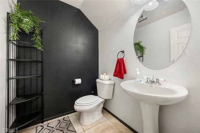 bathroom featuring tile patterned flooring, a textured ceiling, and toilet