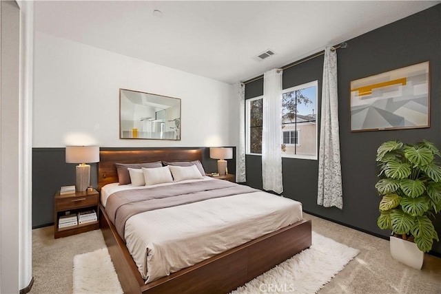 bedroom featuring visible vents and carpet flooring