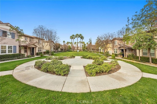 view of community featuring a yard