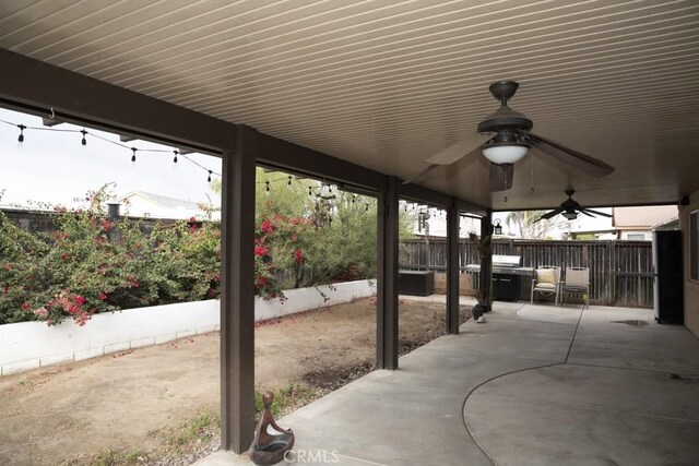 view of patio / terrace featuring ceiling fan and a grill