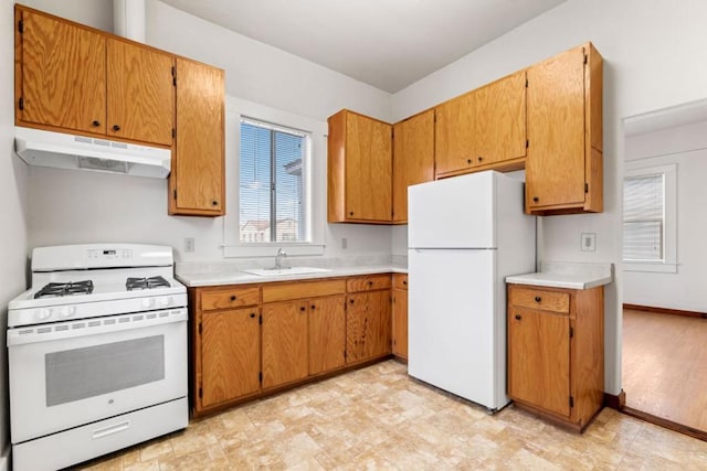 kitchen with sink and white appliances