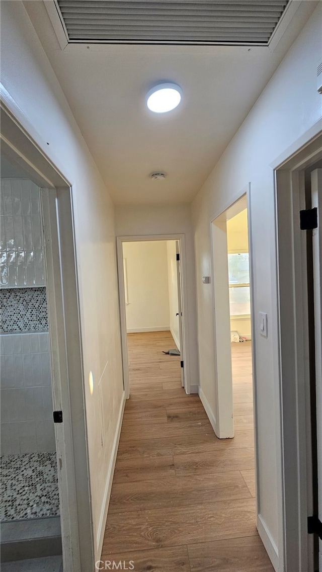 hallway featuring light wood-type flooring