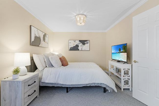 bedroom with carpet floors and ornamental molding