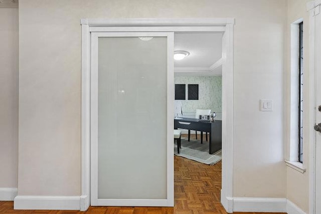 interior space with ornamental molding and parquet floors