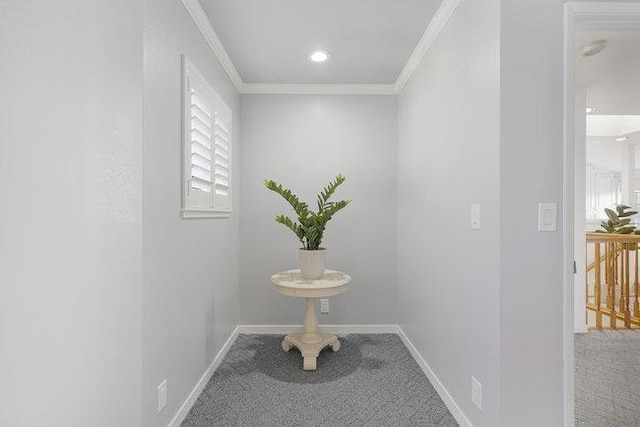 corridor featuring carpet floors and crown molding