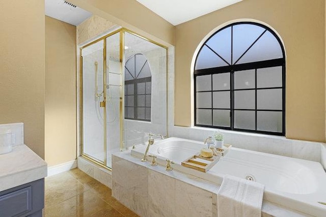 bathroom featuring separate shower and tub, tile patterned flooring, and vanity