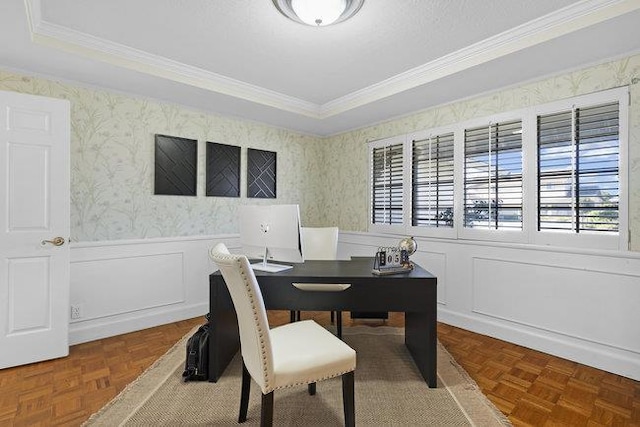 office area with crown molding, a tray ceiling, and parquet flooring