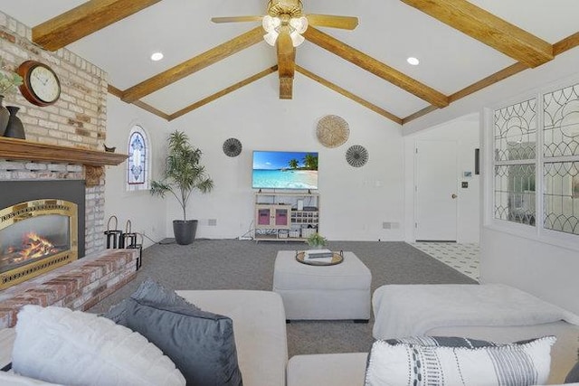 carpeted living room with high vaulted ceiling, a fireplace, ceiling fan, and beamed ceiling