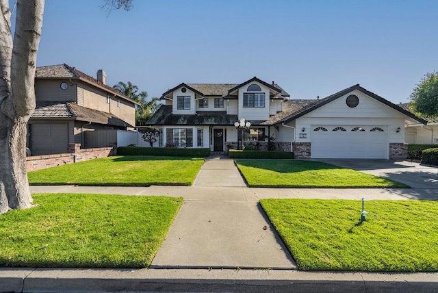 view of front facade featuring a front yard and a garage