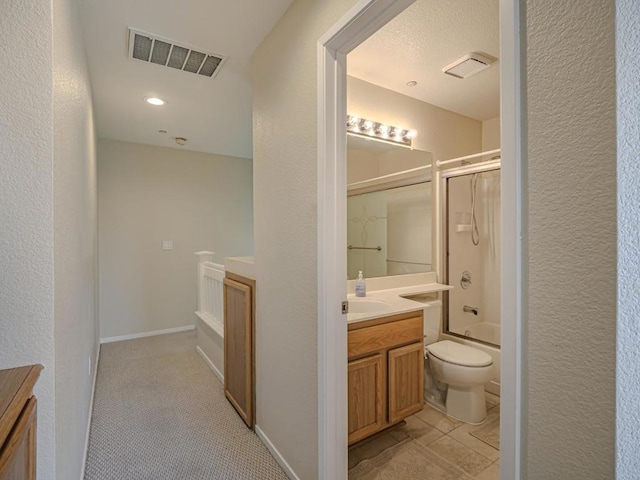 full bathroom with shower / bath combination with glass door, vanity, and toilet