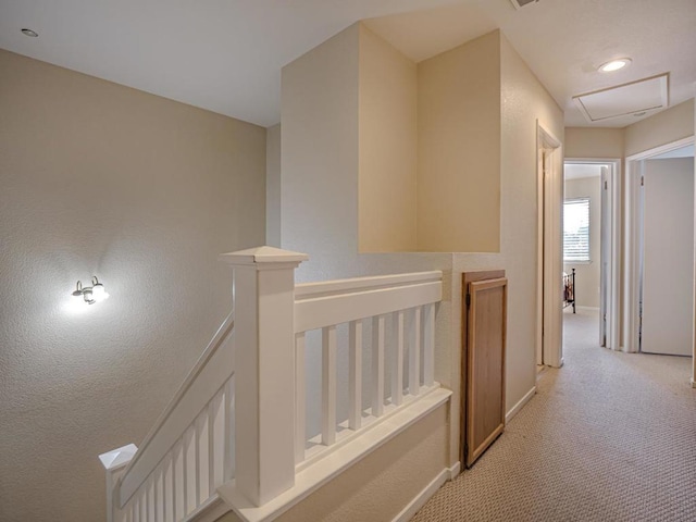 hallway with light carpet