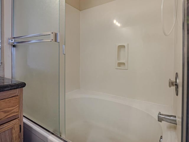 bathroom featuring an enclosed shower