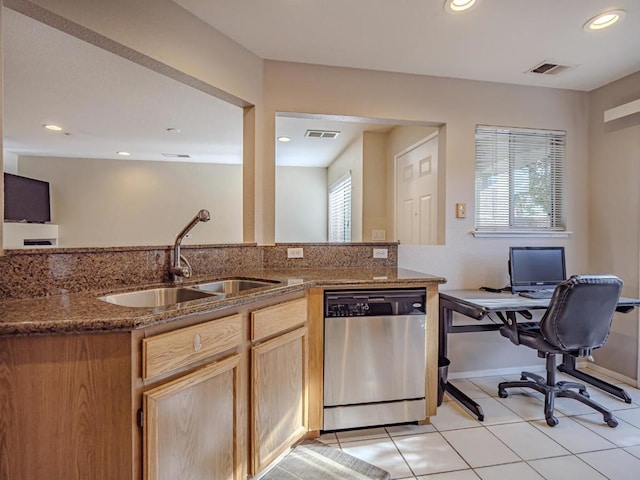 kitchen featuring dishwasher, light tile patterned floors, a healthy amount of sunlight, and sink