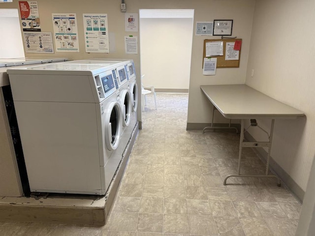 clothes washing area featuring washing machine and clothes dryer