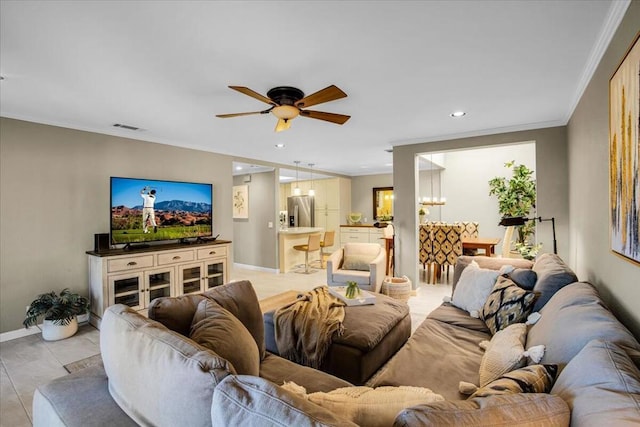 living room featuring ceiling fan and ornamental molding