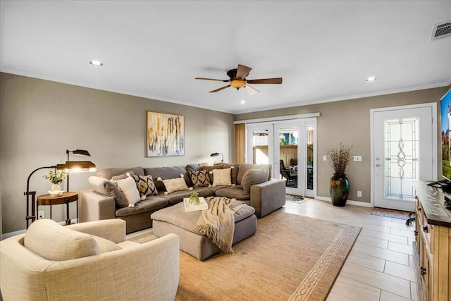 tiled living room with ceiling fan, ornamental molding, and french doors