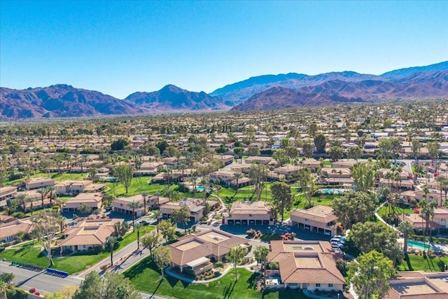 birds eye view of property featuring a mountain view