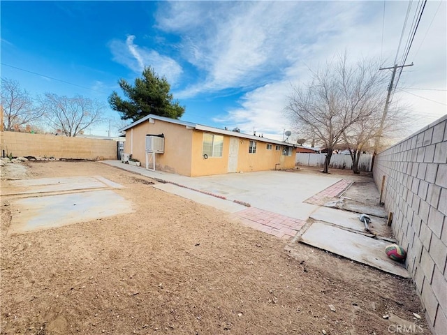 rear view of house featuring a patio area