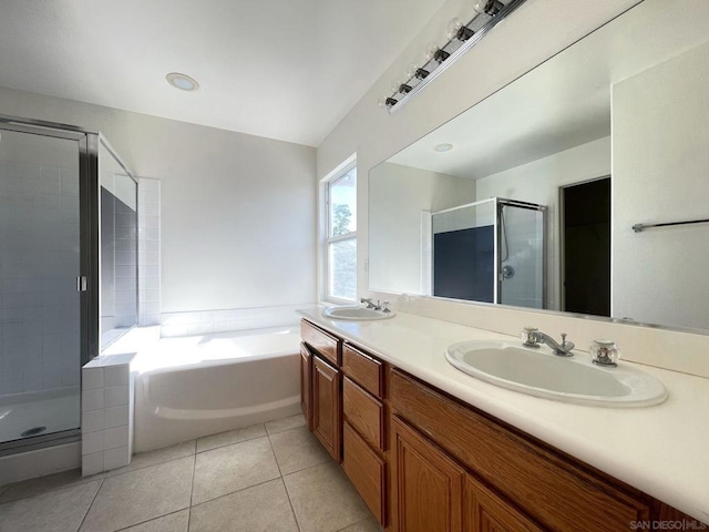 bathroom with vanity, tile patterned flooring, and plus walk in shower