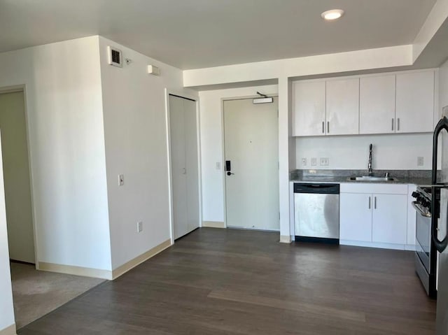 kitchen featuring dark hardwood / wood-style flooring, sink, stainless steel appliances, and white cabinetry