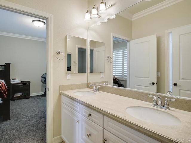 bathroom featuring vanity, an inviting chandelier, and crown molding