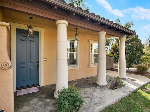 doorway to property with a porch