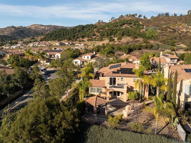 birds eye view of property with a mountain view