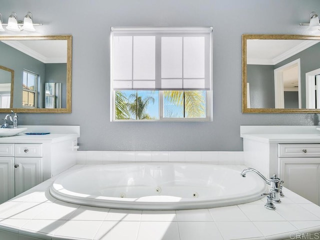 bathroom with vanity, crown molding, and a relaxing tiled tub